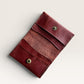 Safir Leather handmade burgundy genuine leather card holder with 4 slots and snap closure. Minimalist, unisex vintage design.