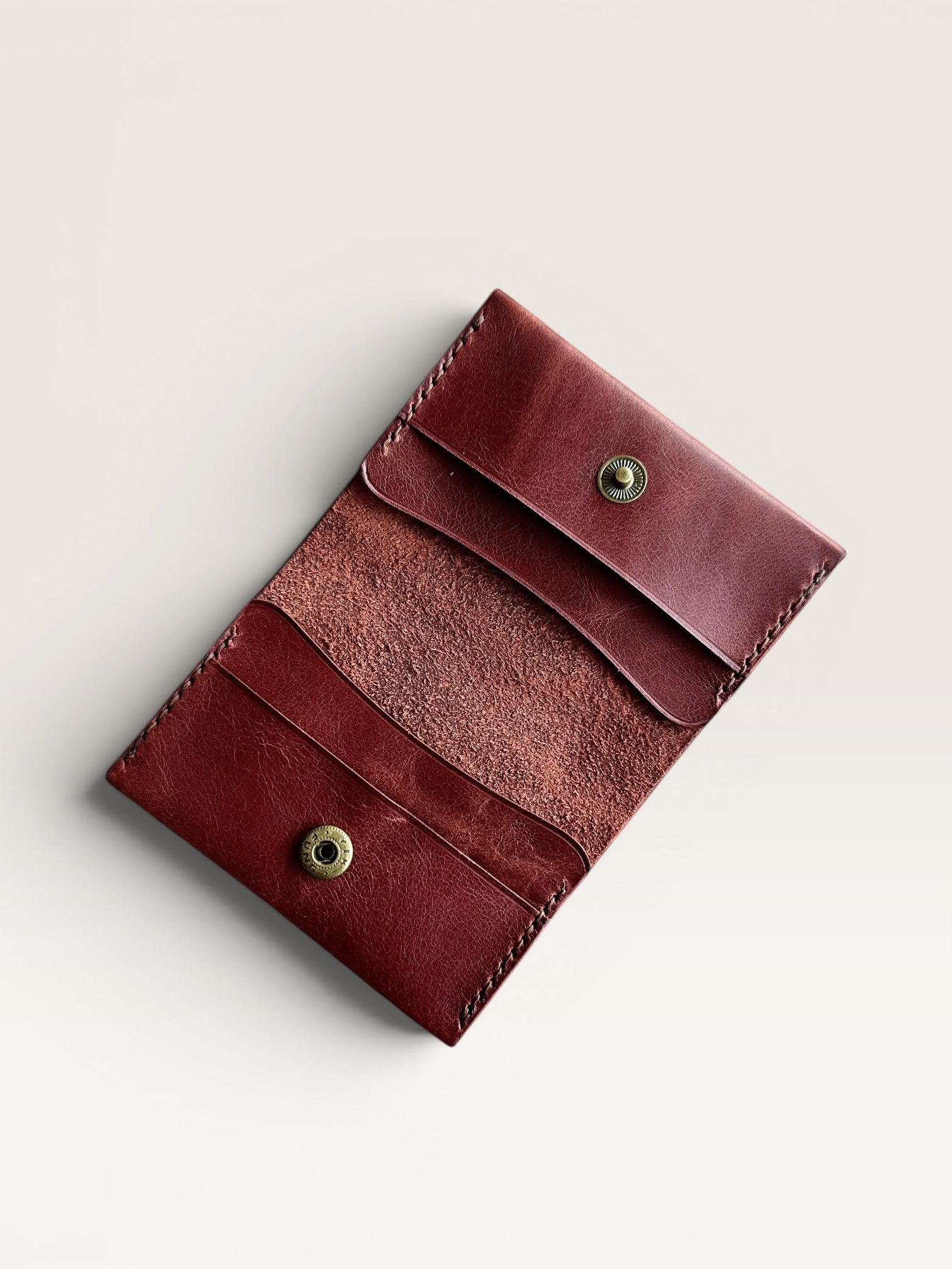 Safir Leather handmade burgundy genuine leather card holder with 4 slots and snap closure. Minimalist, unisex vintage design.
