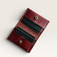 Safir Leather burgundy genuine leather handmade cardholder with 4 card slots and a snap closure. Minimalist unisex design.
