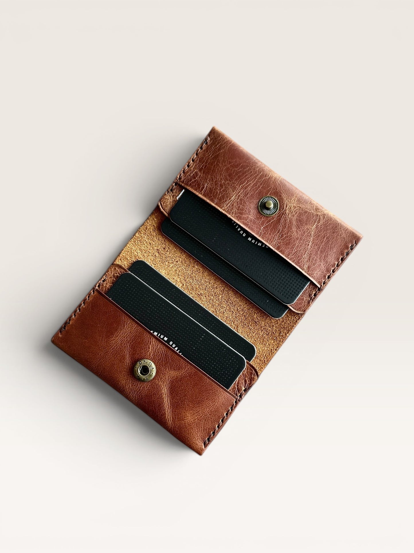 Safir Leather handmade caramel brown genuine leather card holder with 4 card slots and snap closure.