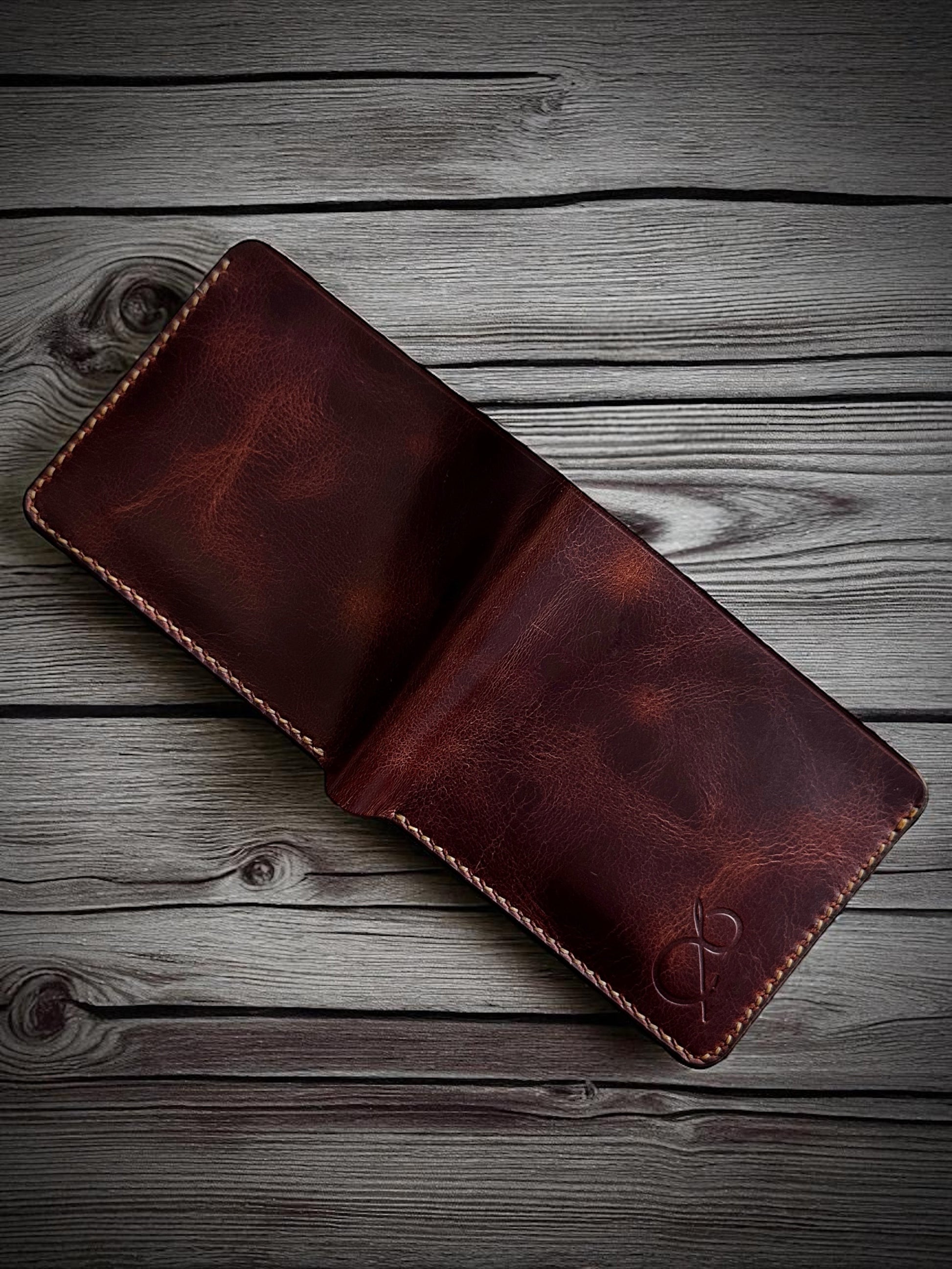 Safir Leather handmade dark brown genuine Italian leather bi-fold wallet with vintage design and embossed logo.
