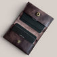 Safir Leather dark brown genuine leather handmade card holder with 4 slots and a snap closure. Minimalist vintage design.