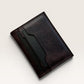 Safir Leather dark brown genuine leather cardholder wallet with minimalist design and stitched edges.