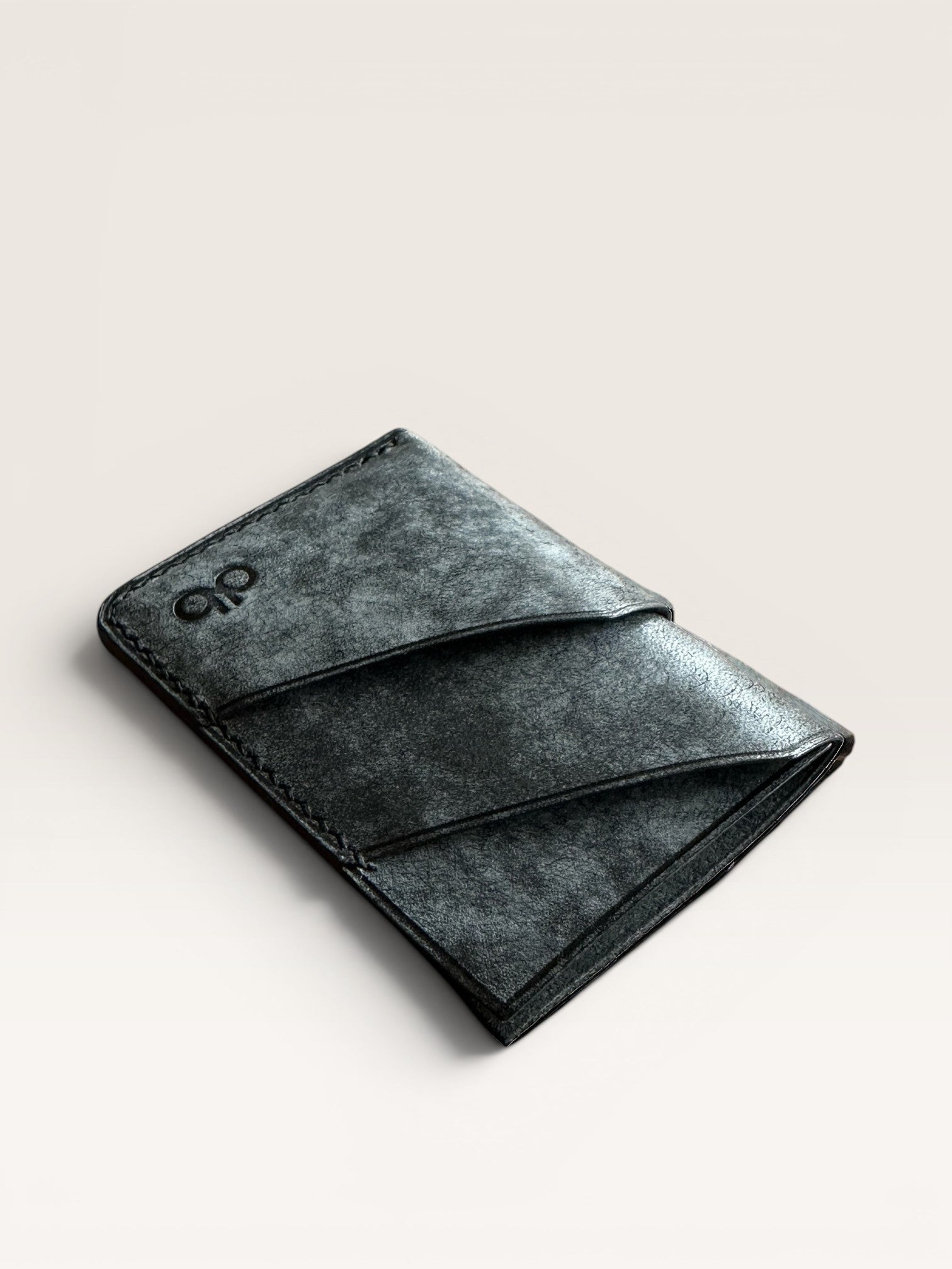 Safir Leather dark grey premium leather cardholder with 4 card slots and unique stitching detail.