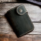 Safir Leather el yapımı, vintage görünümlü, koyu renkli, mumlu dikişli ve çıtçıtlı hakiki deri cüzdan.