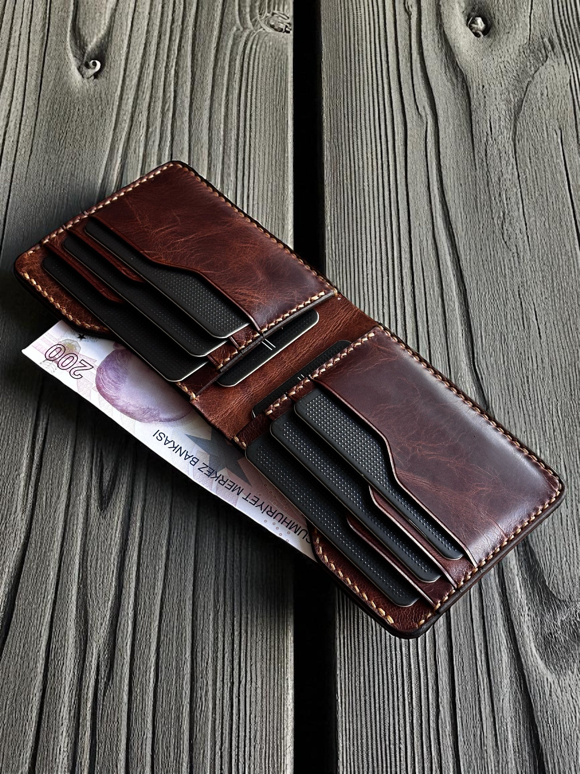 Safir Leather handmade dark brown Italian leather bifold wallet with card slots and cash compartment.