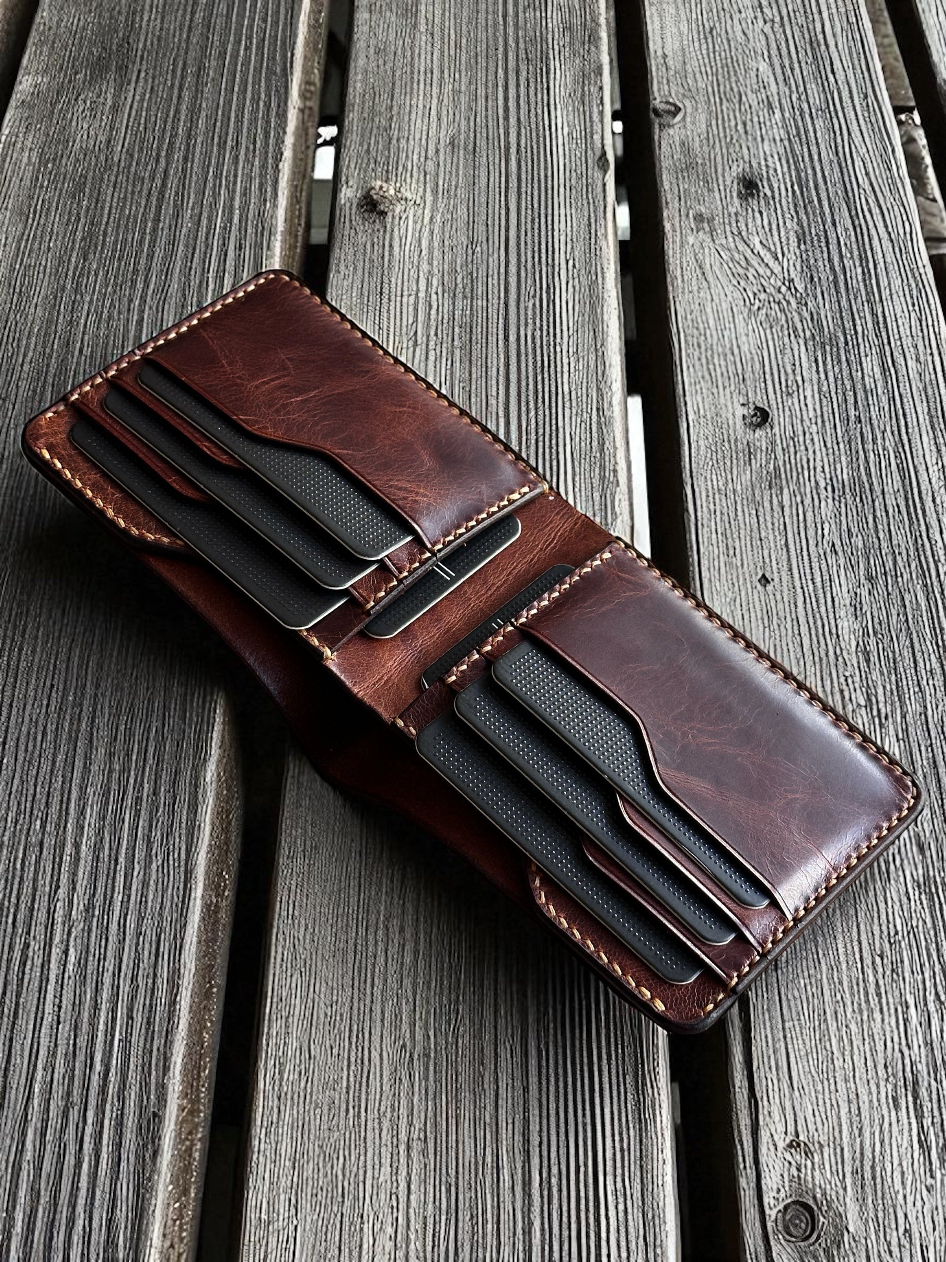 Safir Leather handmade dark brown Italian leather bifold wallet with multiple card slots.