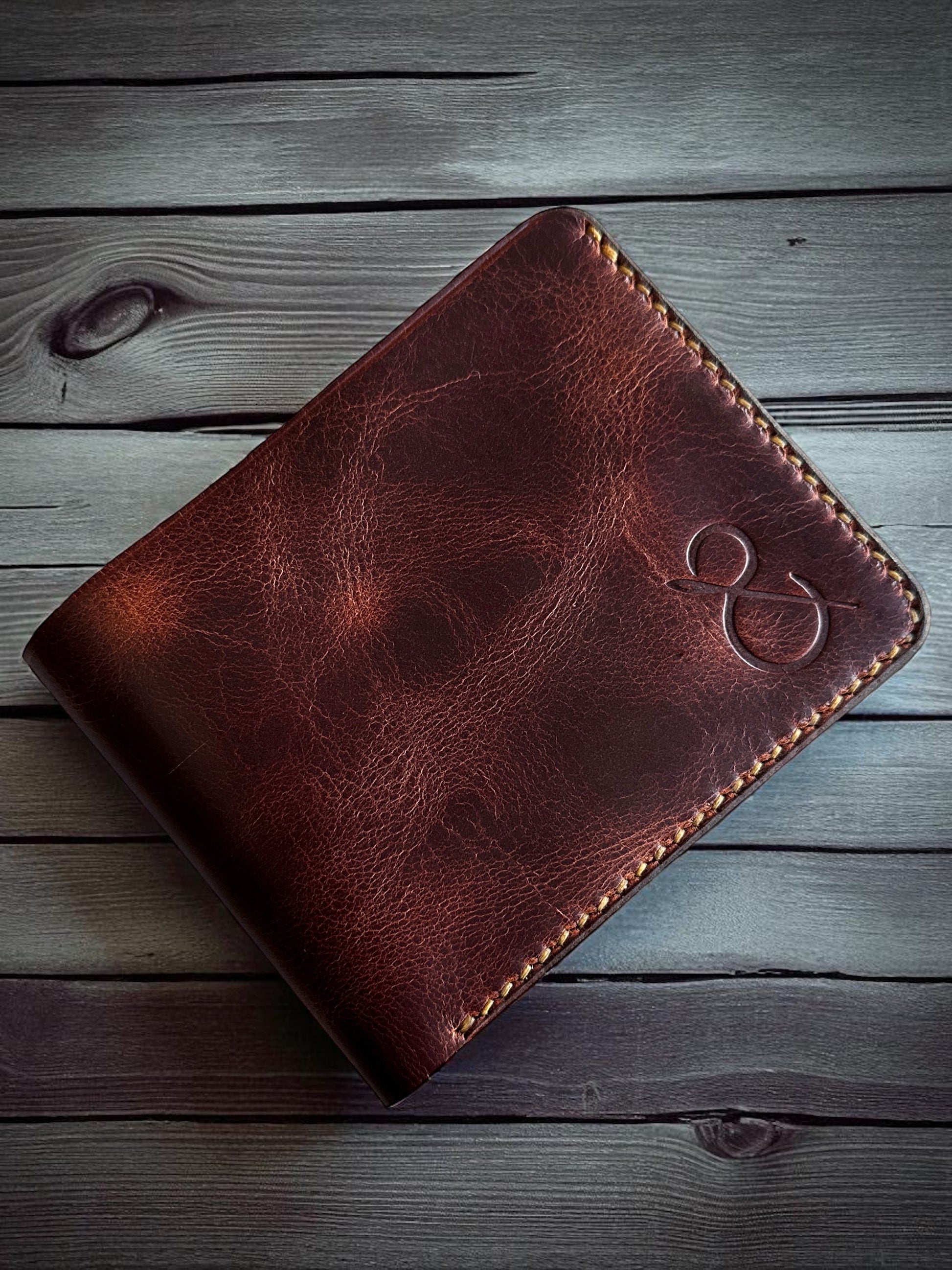 Safir Leather handmade dark brown genuine Italian leather bi-fold wallet with vintage design and embossed logo.