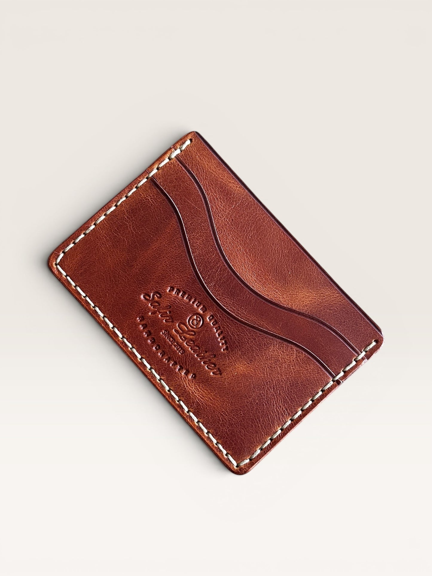 Safir Leather brown handmade Italian leather cardholder with 5 card slots and organic stitching.