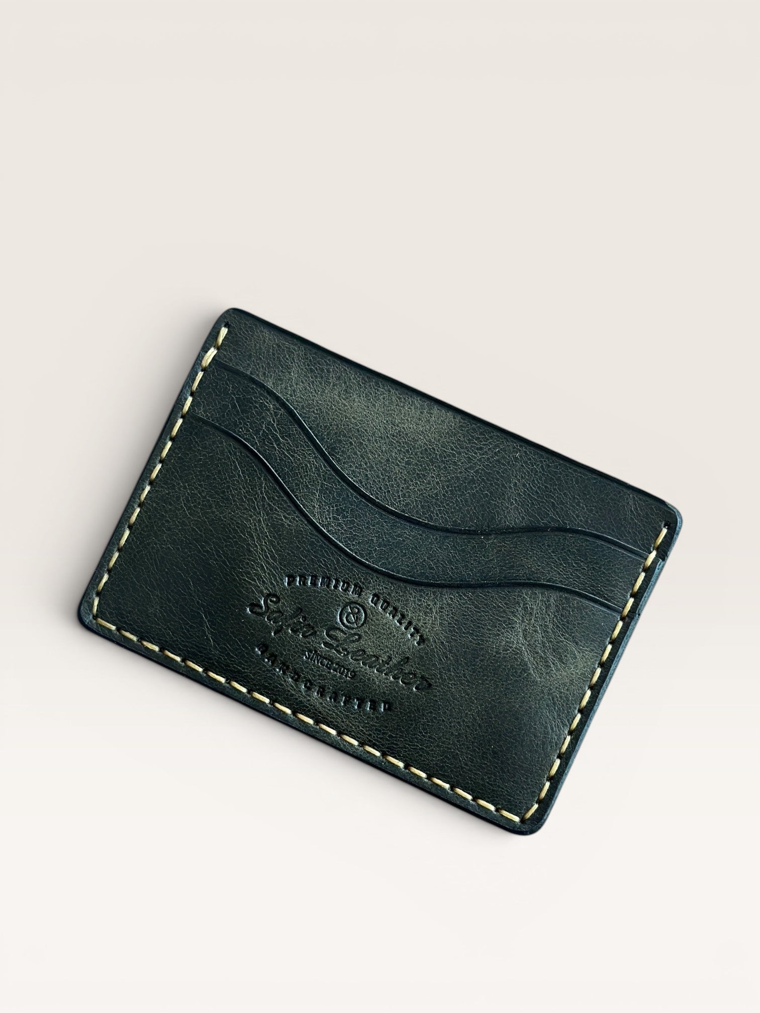 Safir Leather dark green handmade Italian leather cardholder with 5 compartments and organic stitching.