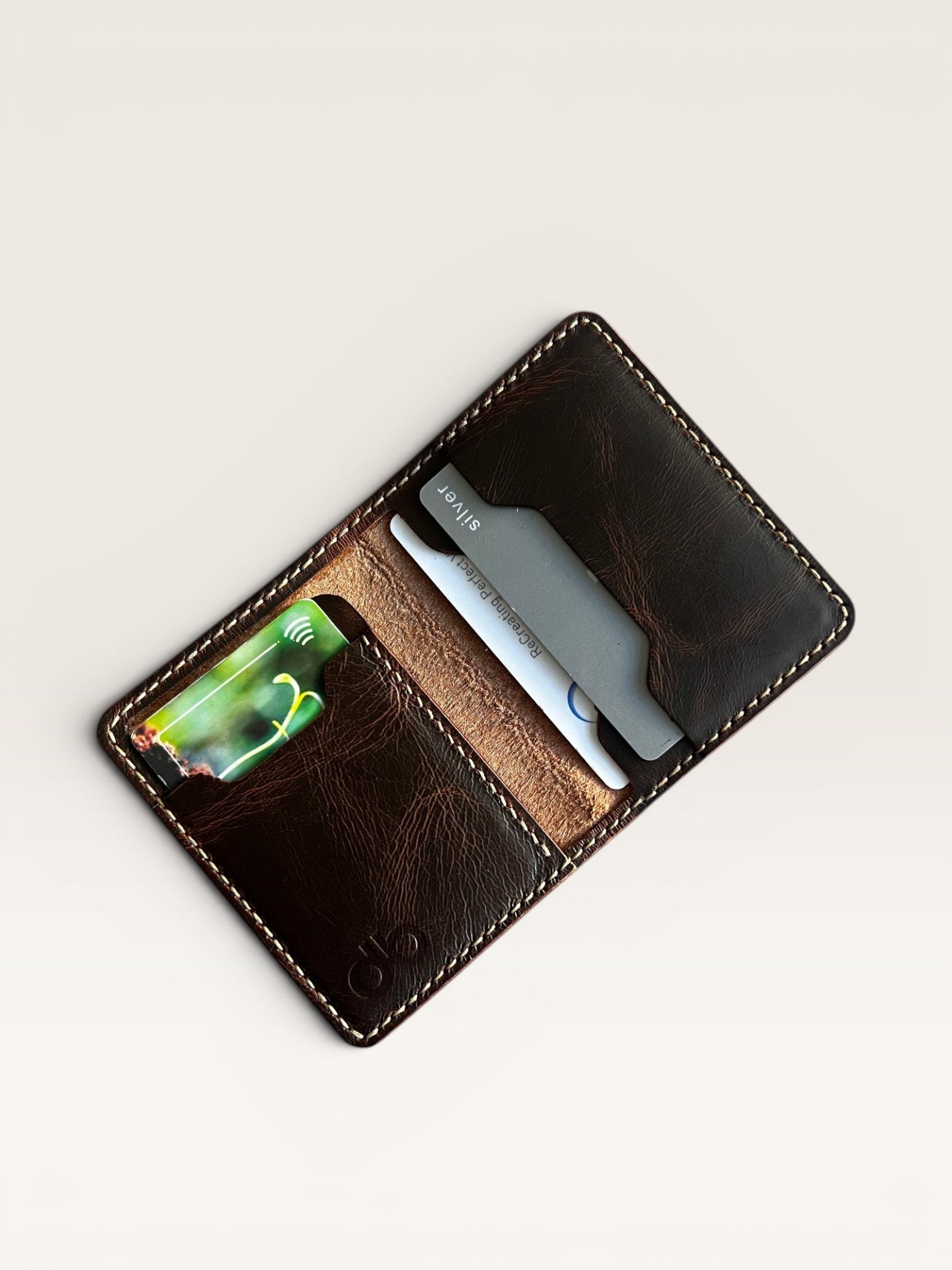 Safir Leather Italian brown distressed leather minimalist wallet with card slots, hand-stitched with cream thread.