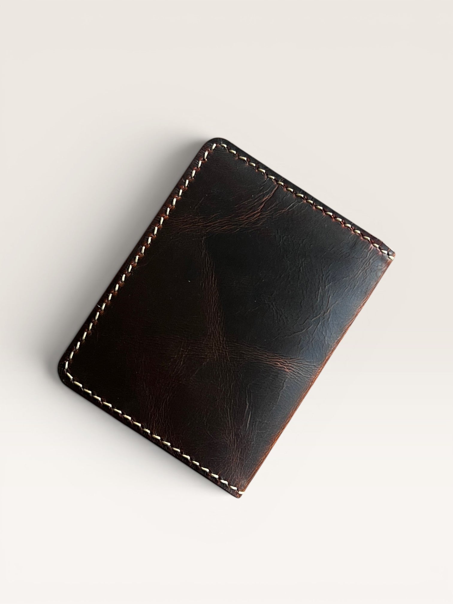 Safir Leather Italian dark brown genuine leather minimalist wallet with contrast stitching.