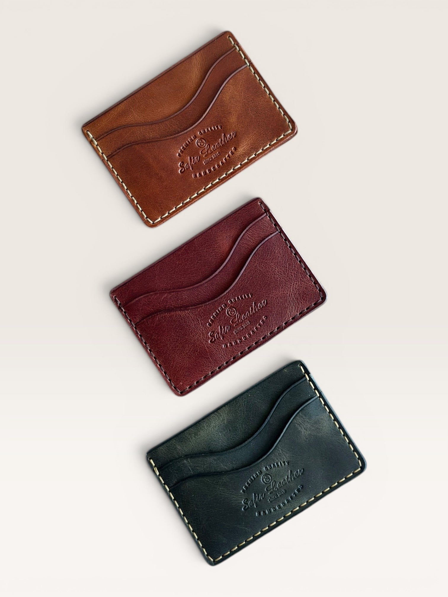 Safir Leather handmade Italian leather cardholder in brown, burgundy, and dark green with 5 card slots.