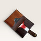 Safir Leather minimalist card holder made of genuine brown and dark brown leather. Features multiple card slots and a snap closure.