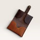 Safir Leather minimalist card holder made of genuine leather in brown and tan with a snap closure.