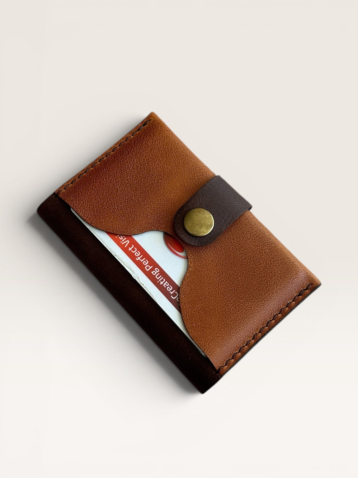 Safir Leather minimalist brown genuine leather cardholder with brass snap closure, 6.8cm H x 10.5cm W.