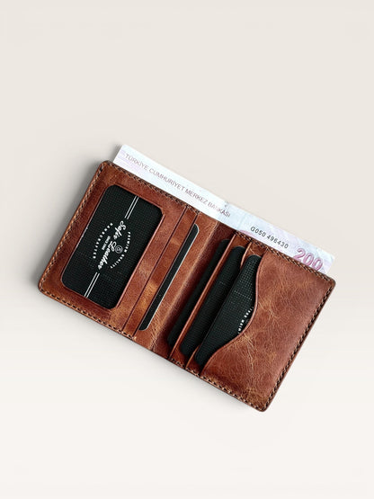 Safir Leather Babil PM Gold İtalyan deri cüzdan, kart ve para bölmeli, zarif ve dayanıklı.